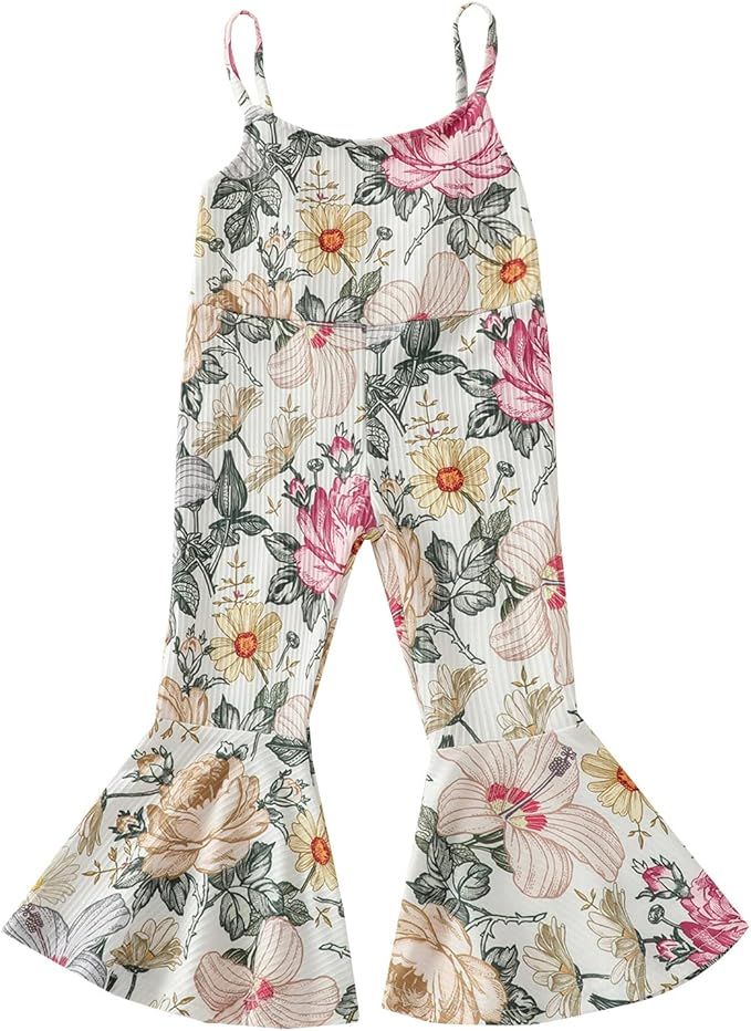 Set of floral ruffle-trimmed tank tops with pink and beige flowers on white fabric displayed in a row.
