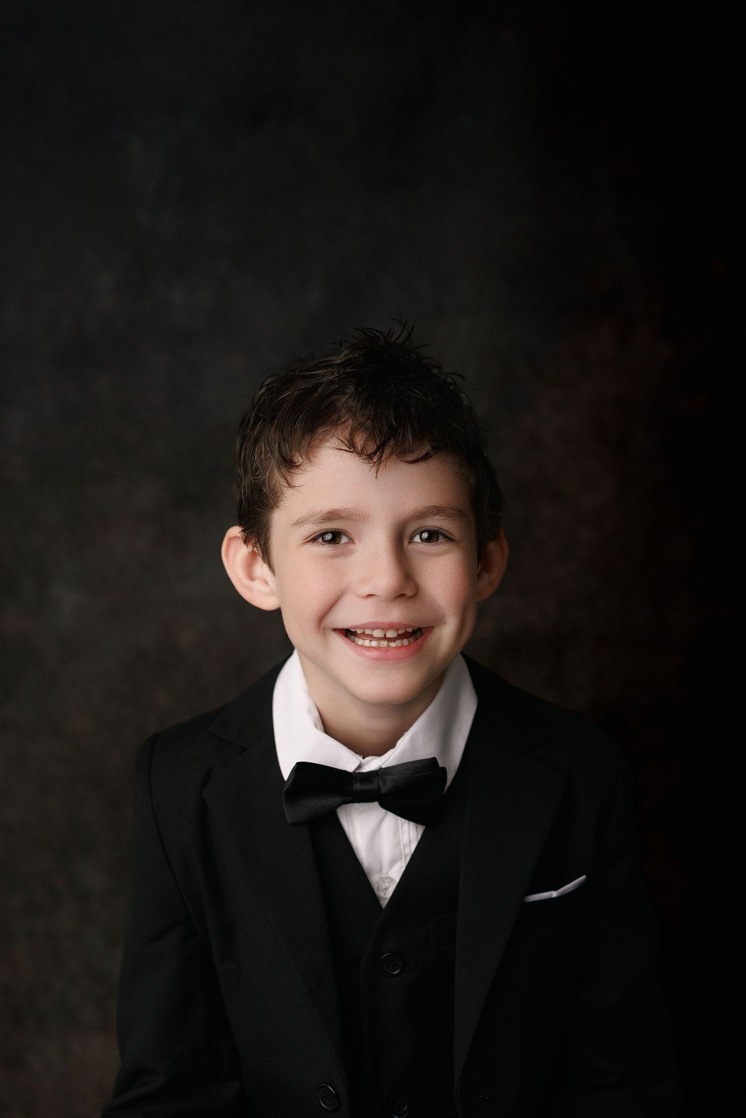 Kinder graduation portrait session with cap and gown in Port Neches, TX with Bree Elle Photography.