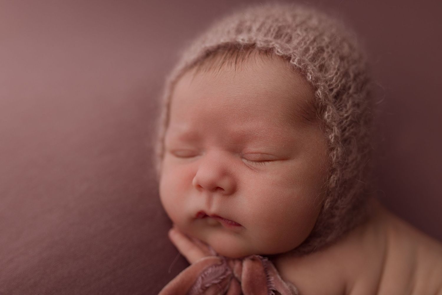 Baby girl during newborn session with Bree Elle Photography in Port Neches, TX studio.