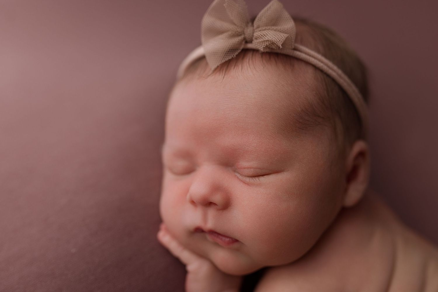Baby girl during newborn session with Bree Elle Photography in Beaumont, TX.
