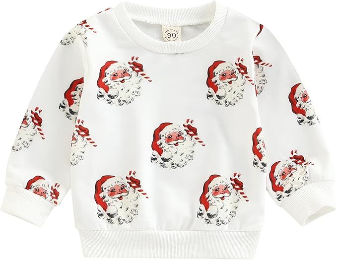 White toddler sweatshirt with repeating vintage Santa Claus face pattern in red and black design.