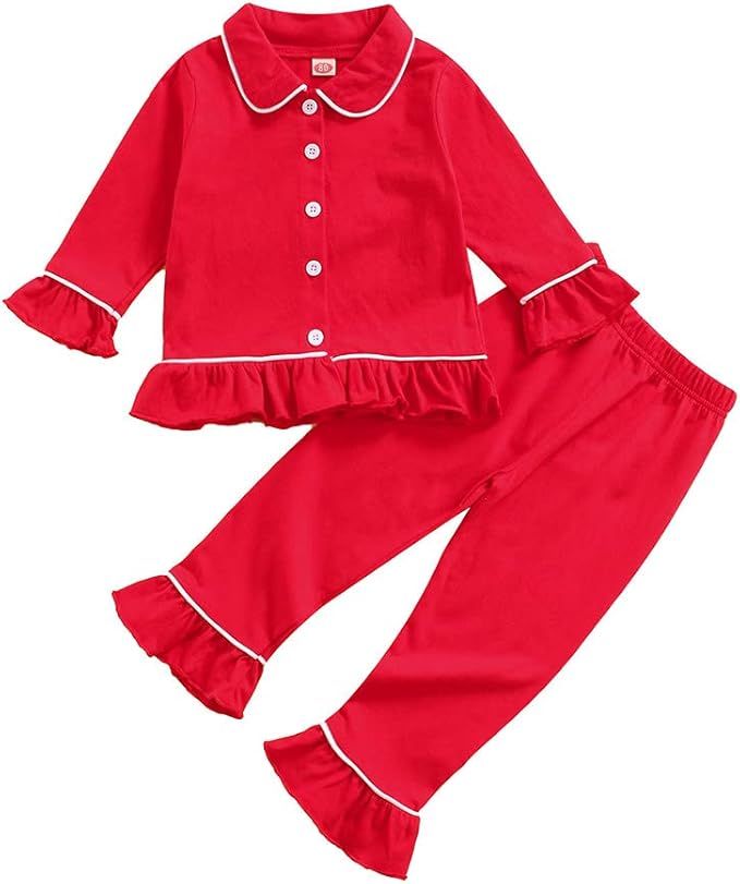 Red two-piece children's pajama set with white piping trim, peter pan collar and ruffle sleeve details.
