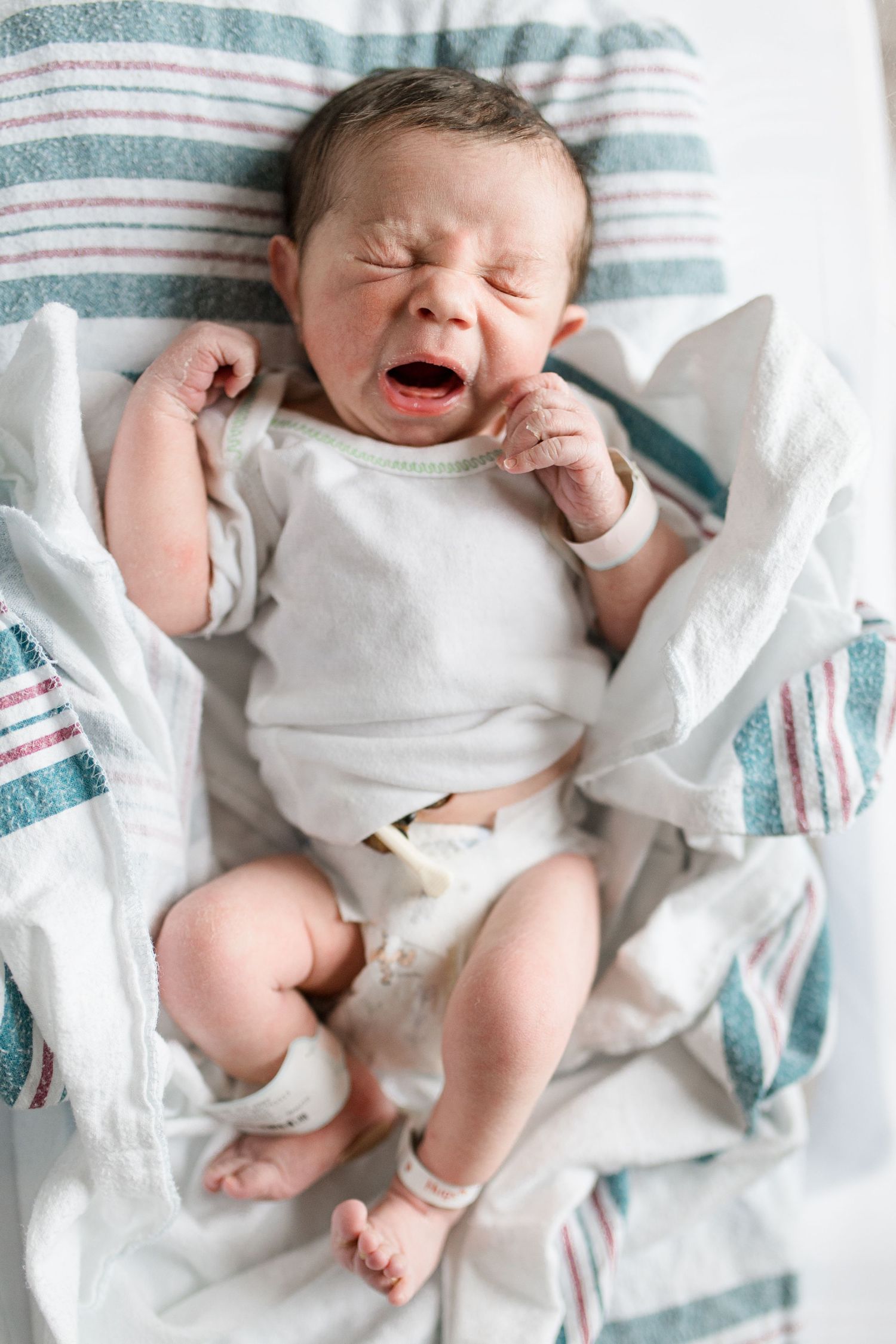 Newborn baby during Fresh 48 session at Baptist Hospital in Beaumont, TX. Photographed by Bree Elle Photography.