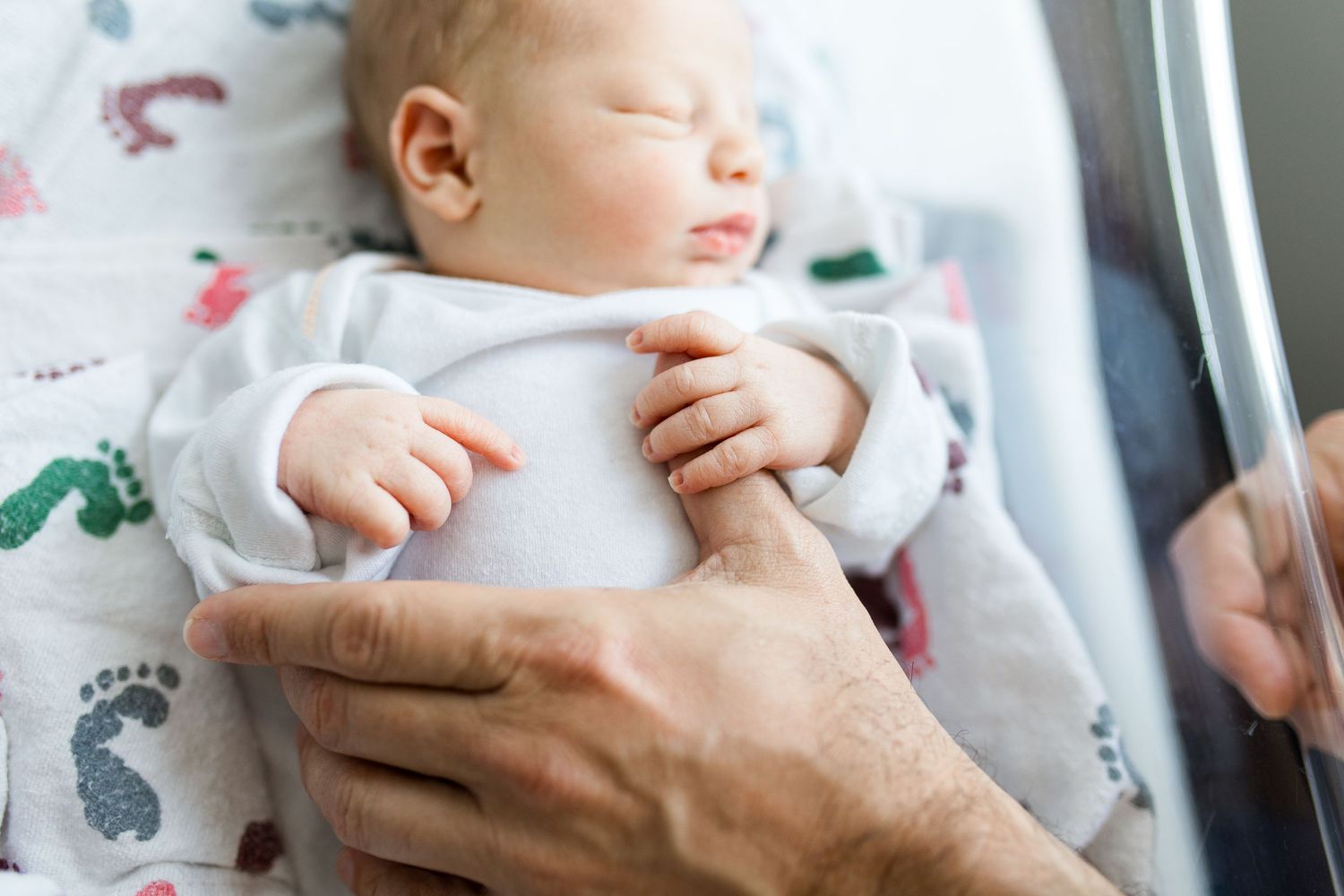 Newborn baby during Fresh 48 session at St. Elizabeth hospital in Beaumont, TX with Bree Elle Photography.