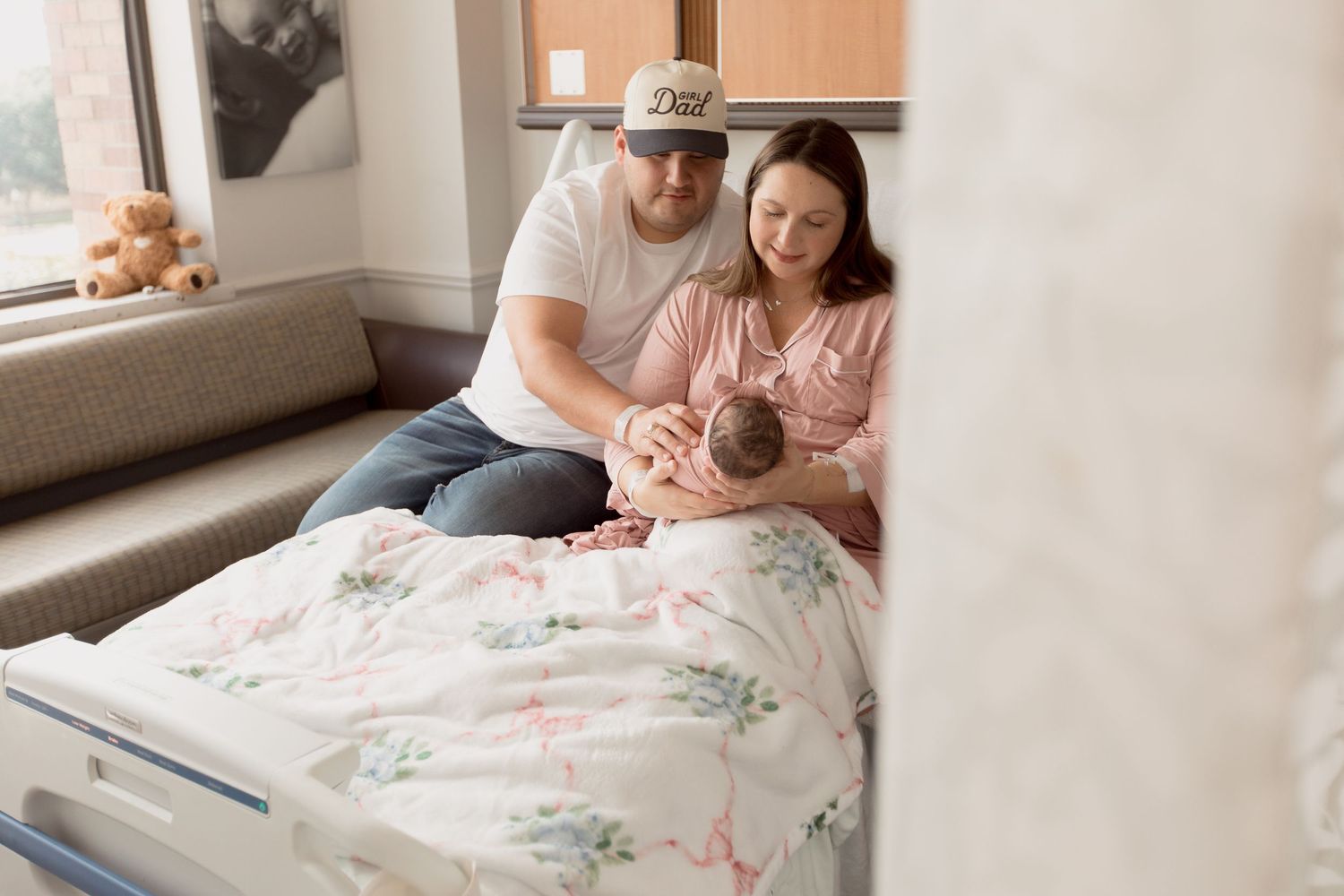 A parent and newborn baby share tender moments in a series of intimate hospital and home photographs.