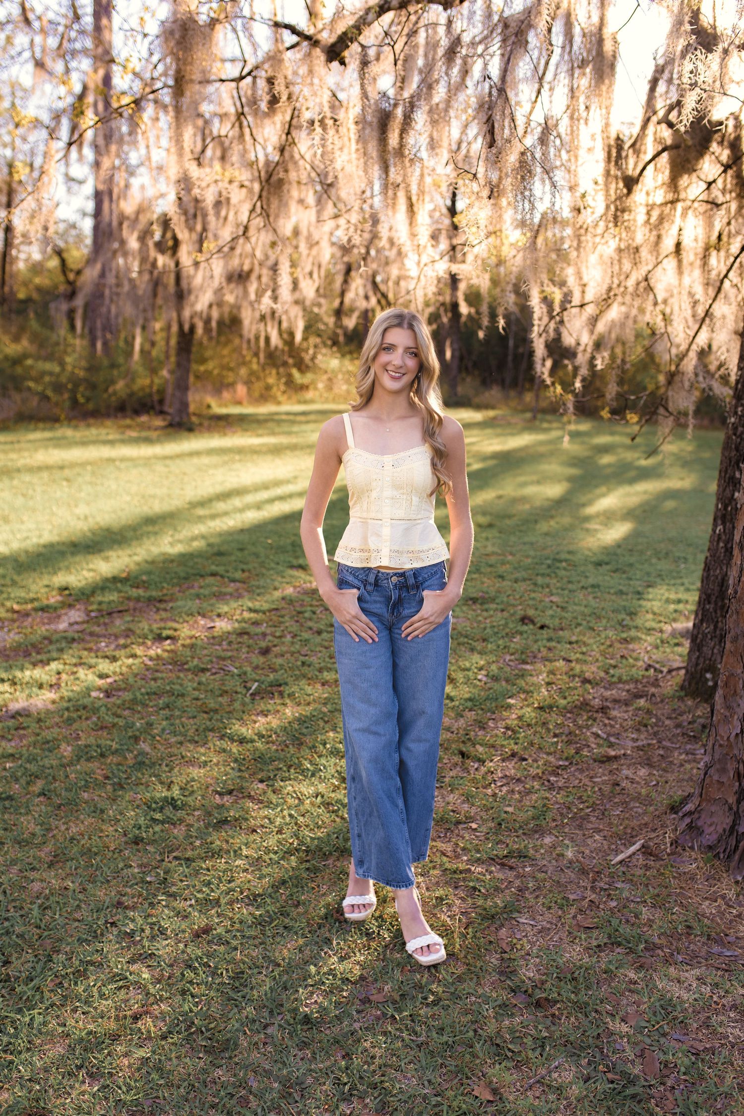 High School Senior taking graduation photos in Silsbee, TX with Bree Elle Photography's associate photographer, Alicia. Beaumont, Lumberton