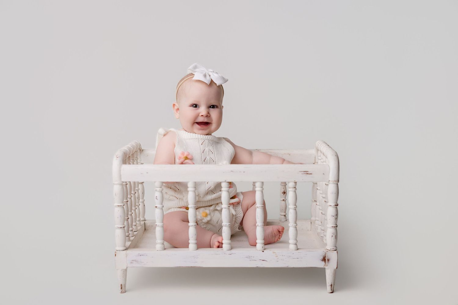 6 month old baby girl during milestone session with Bree Elle Photography in Port Neches, TX.