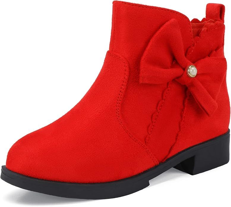 Red suede ankle boot with decorative bow and rhinestone detail featuring a low heel and black sole.