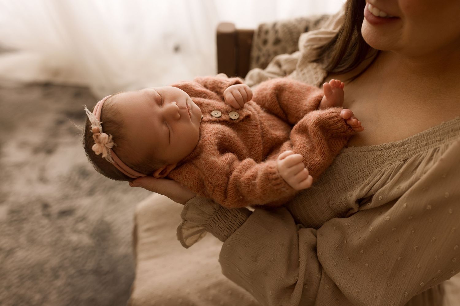Baby girl during newborn session with Bree Elle Photography in Port Neches, TX studio.