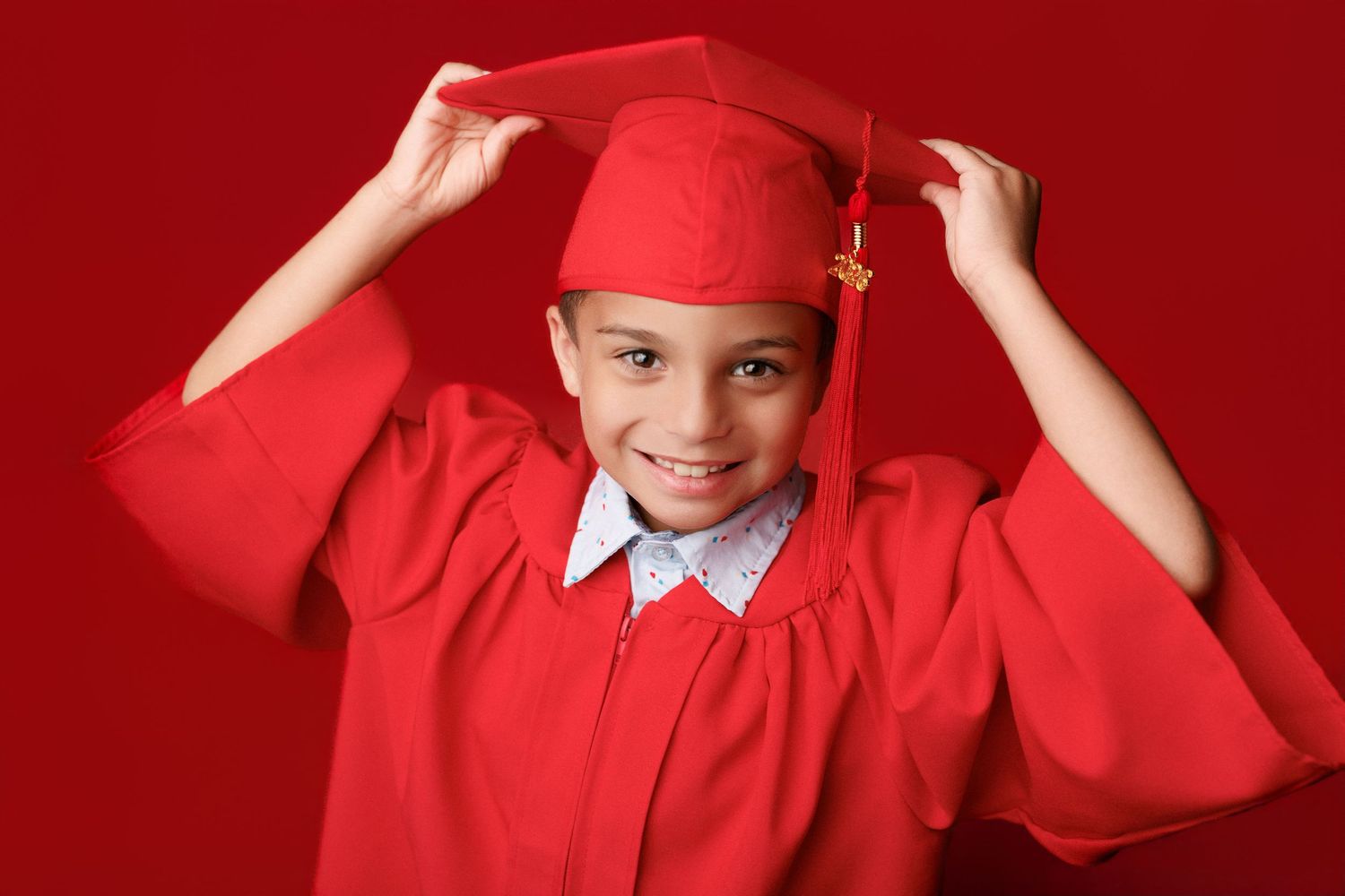 Bridge City kinder graduation portrait session with cap and gown in Port Neches, TX with Bree Elle Photography.