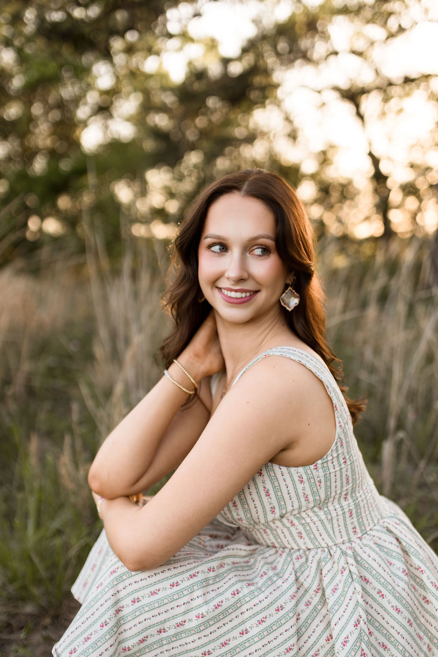 Bree Elle Photography Seniors by Alicia Stephenson. Session with girl in a Beaumont, TX field during senior year photo session.