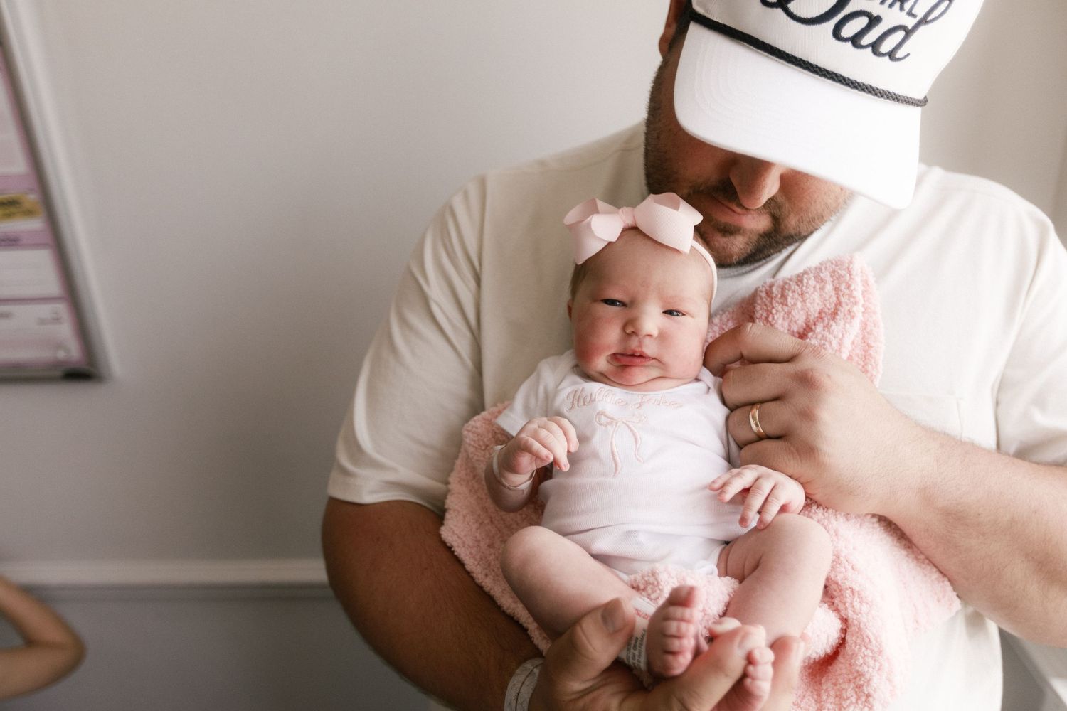 Newborn baby girl and dad during Fresh 48 session in Beaumont hospital.