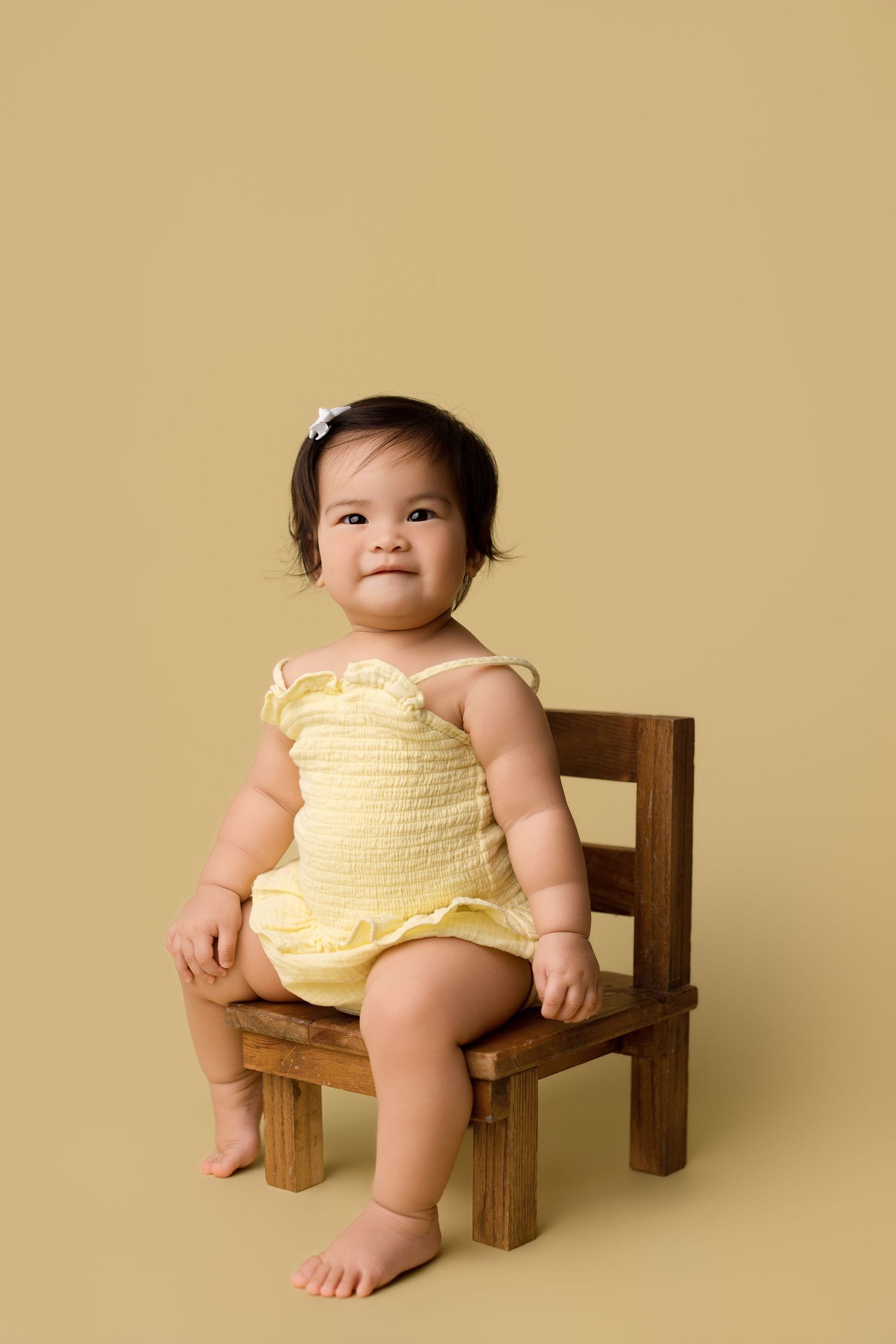One year old during her portrait portion of her one year session with Bree Elle Photography in Port Neches, TX.