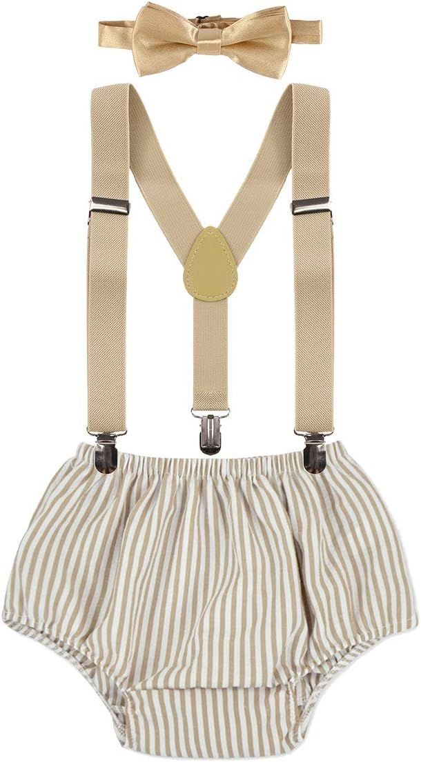 A set of vintage-style beige suspenders and bow tie paired with white and tan striped diaper covers.