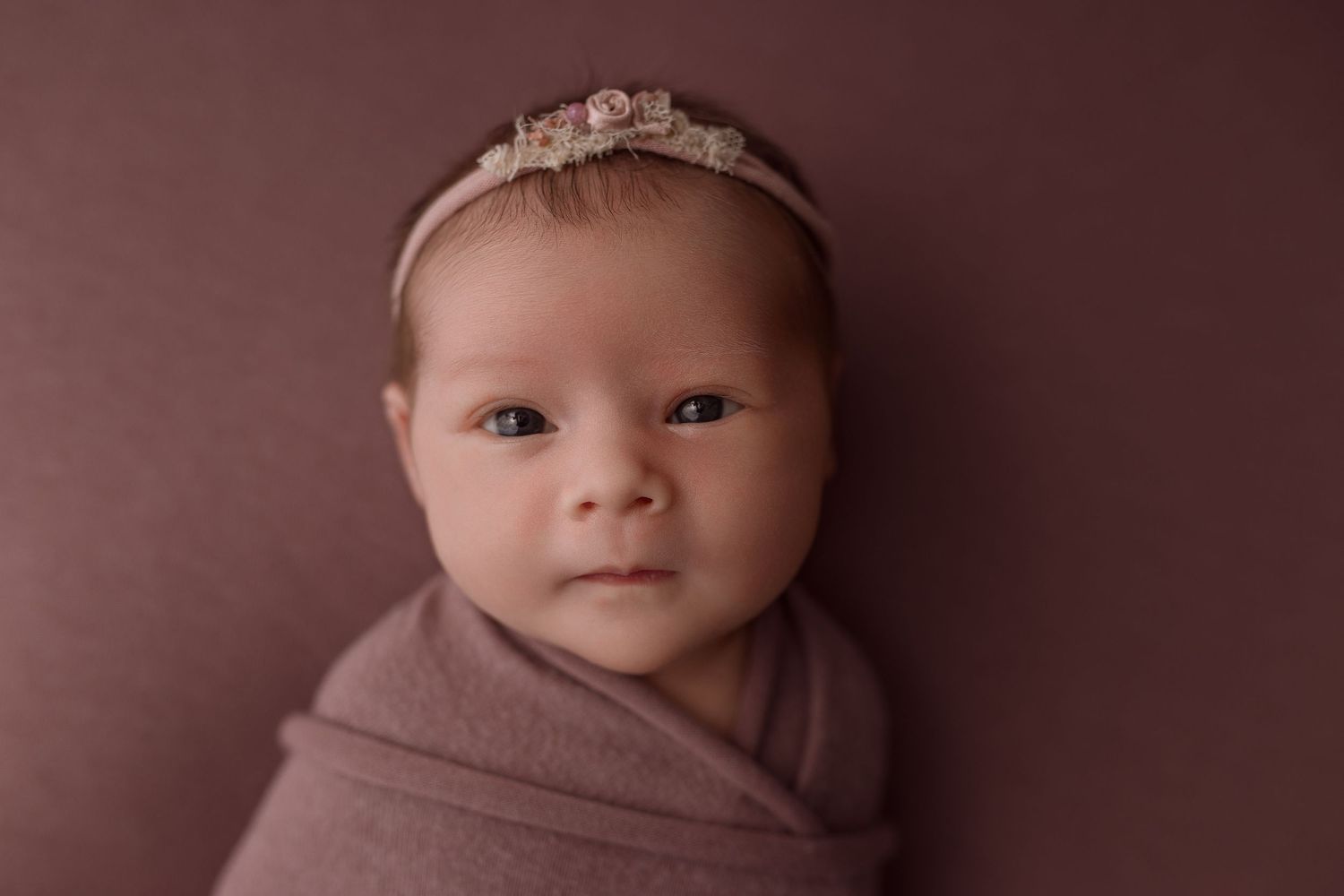 Newborn baby girl during newborn session with Bree Elle Photography in Port Neches, TX studio.