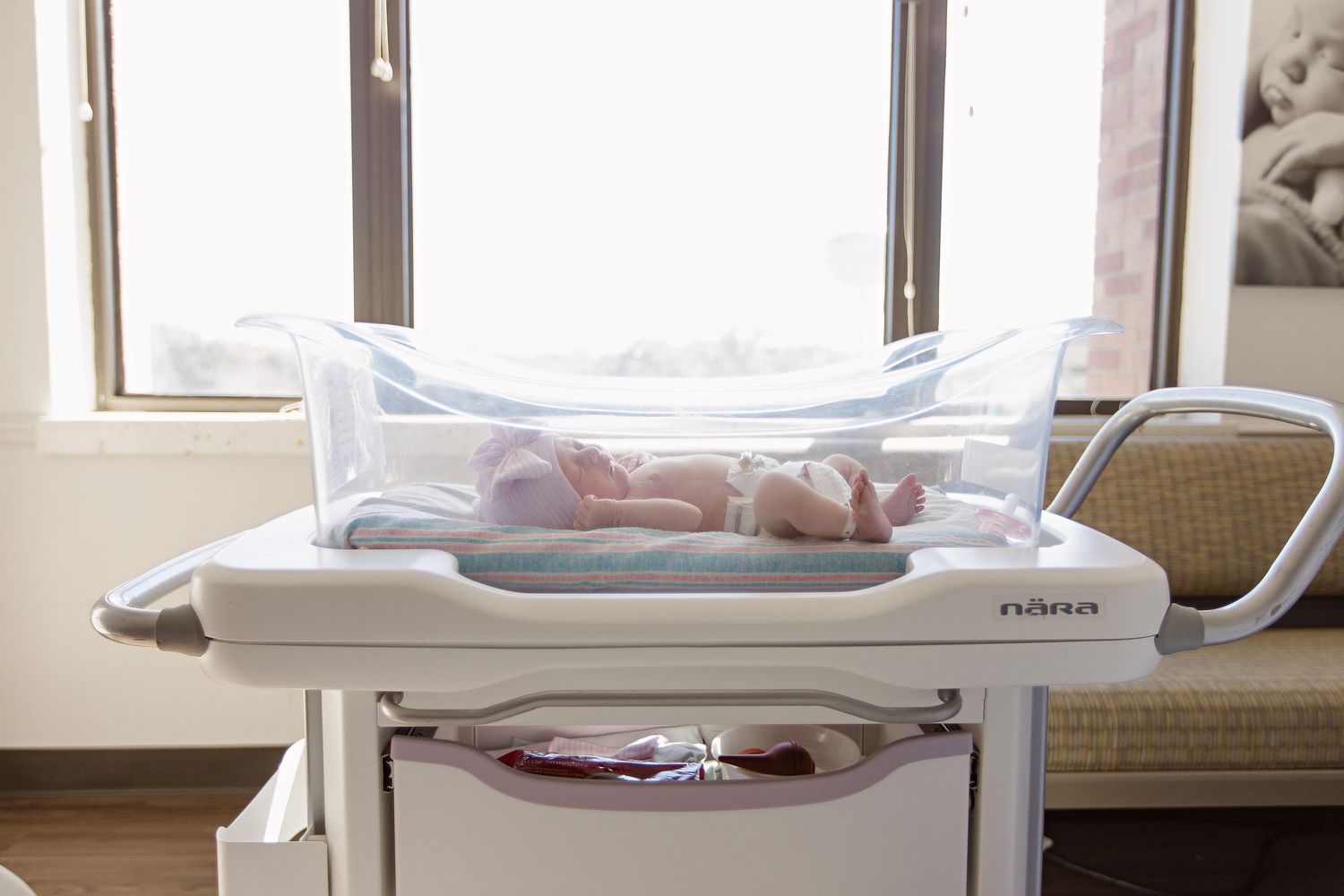 Newborn in hospital bassinet by windows in a maternity ward during Fresh 48 session in Beaumont hospital.
