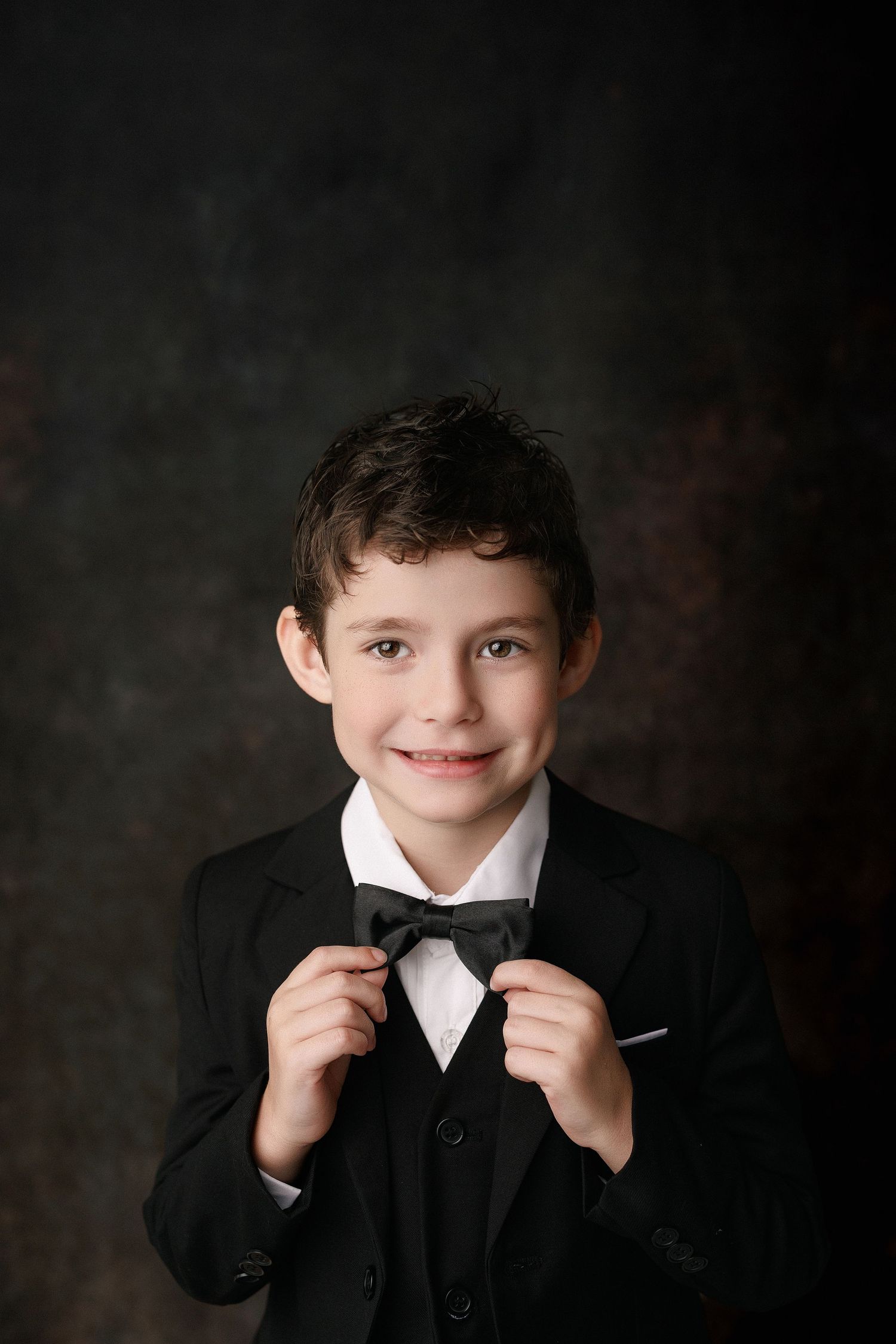 Kinder graduation portrait session with cap and gown in Port Neches, TX with Bree Elle Photography.