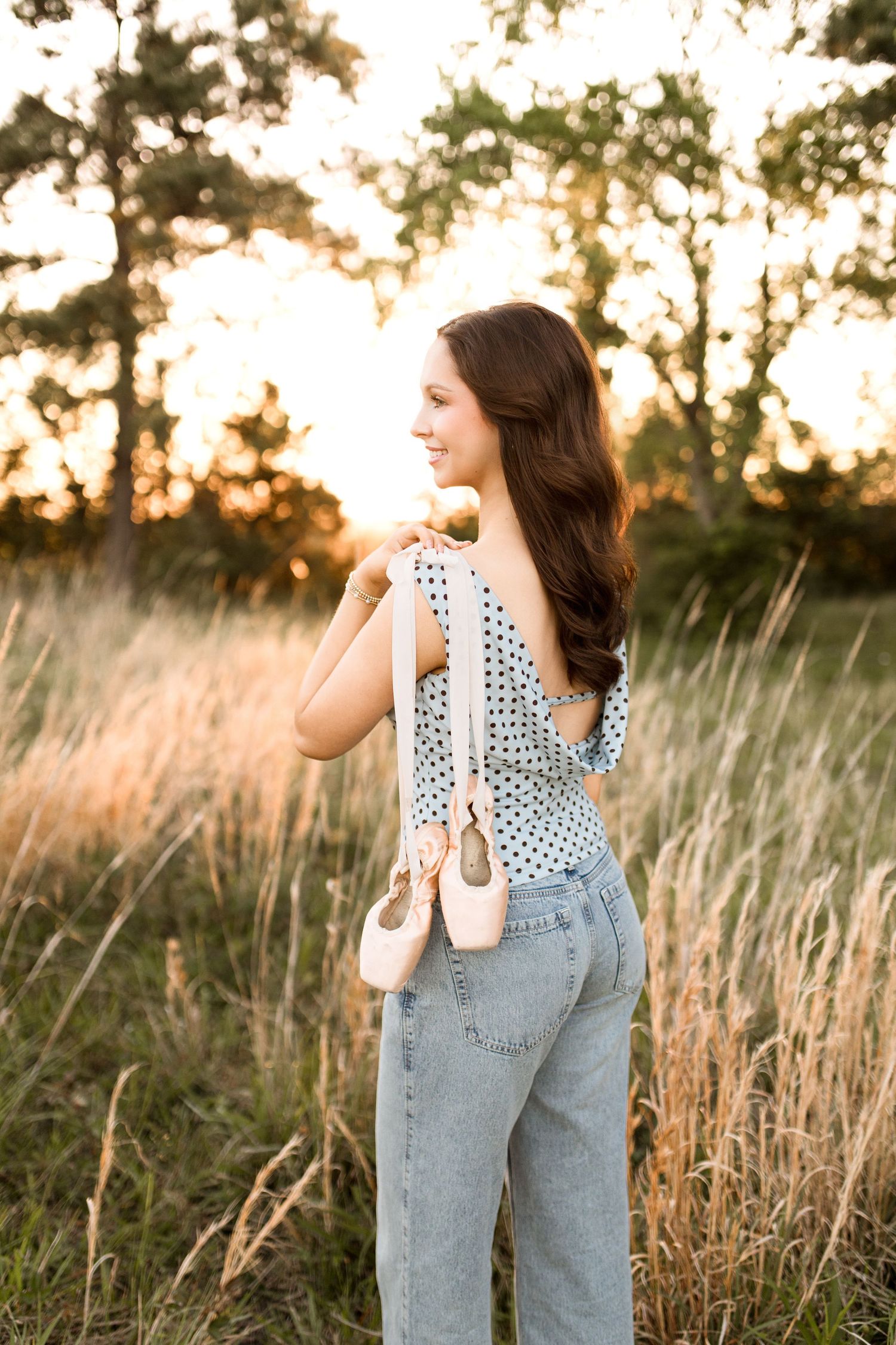 Bree Elle Photography Seniors by Alicia Stephenson. Session with girl in a Beaumont, TX field during senior year photo session.