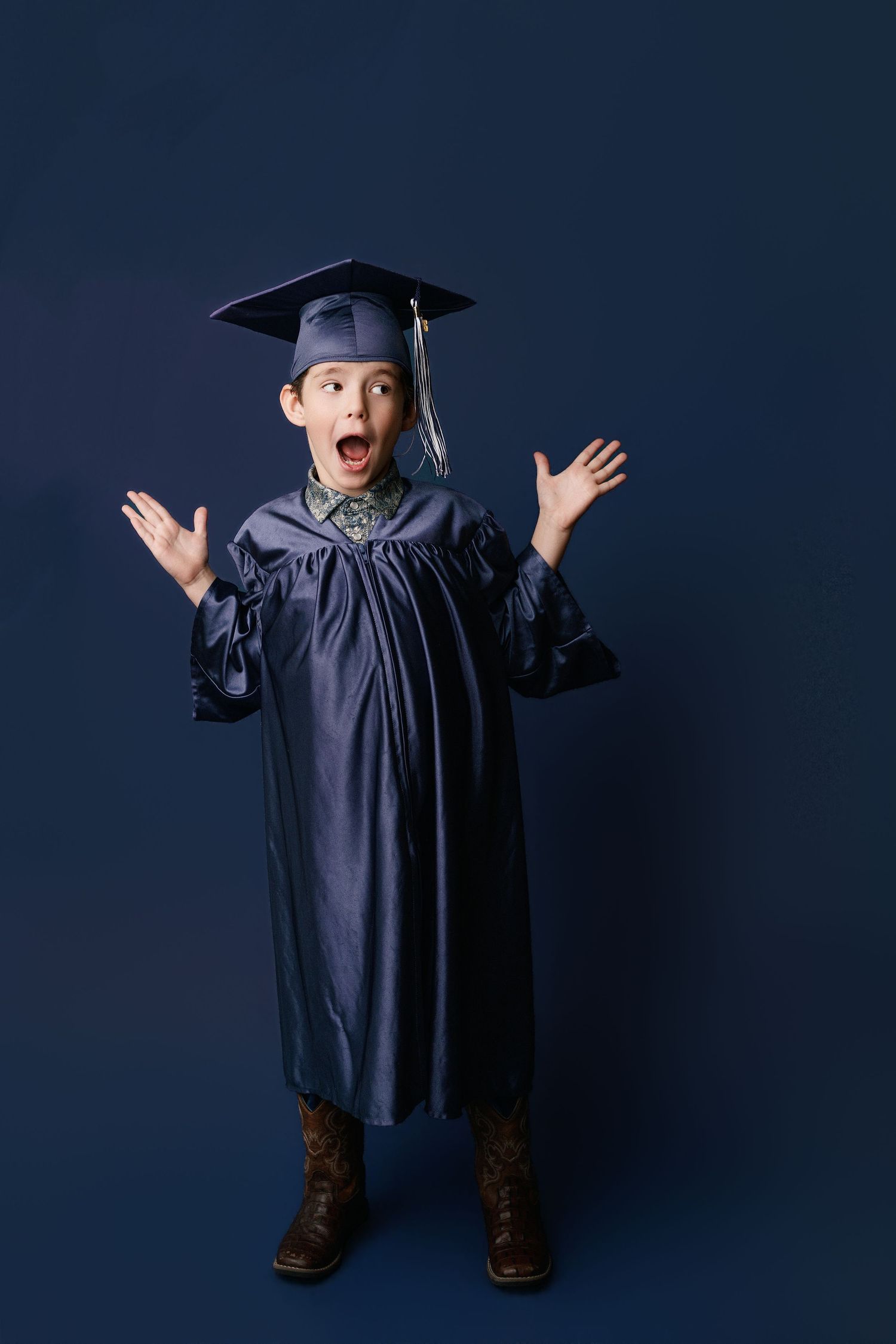 Kinder graduation portrait session with cap and gown in Port Neches, TX with Bree Elle Photography.