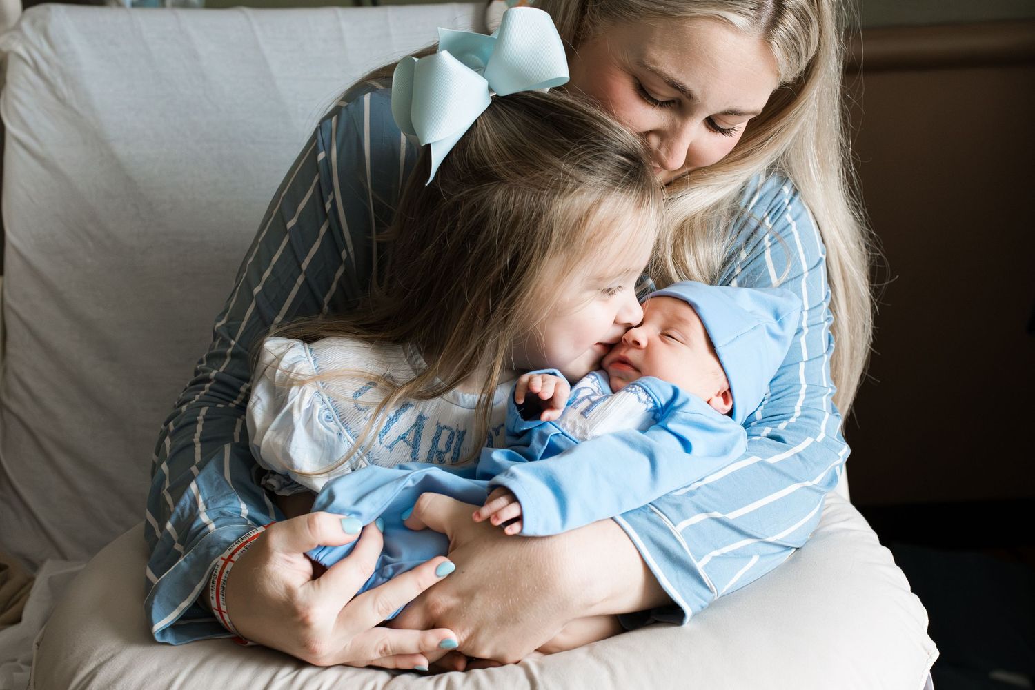 Mom, big sister, and newborn baby boy during Fresh 48 session with Bree Elle Photography in Beaumont, TX hospital.