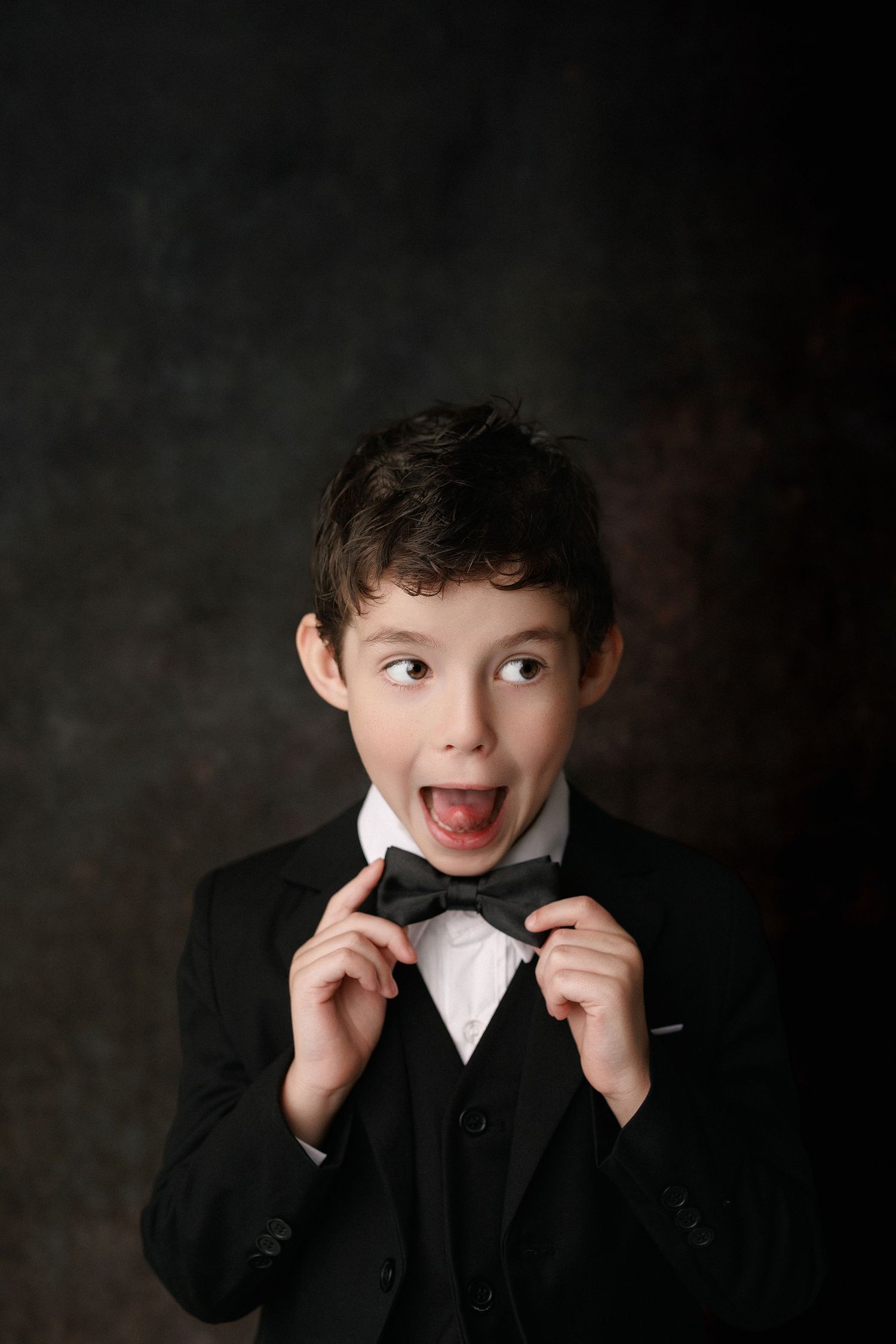 Kinder graduation portrait session with cap and gown in Port Neches, TX with Bree Elle Photography.