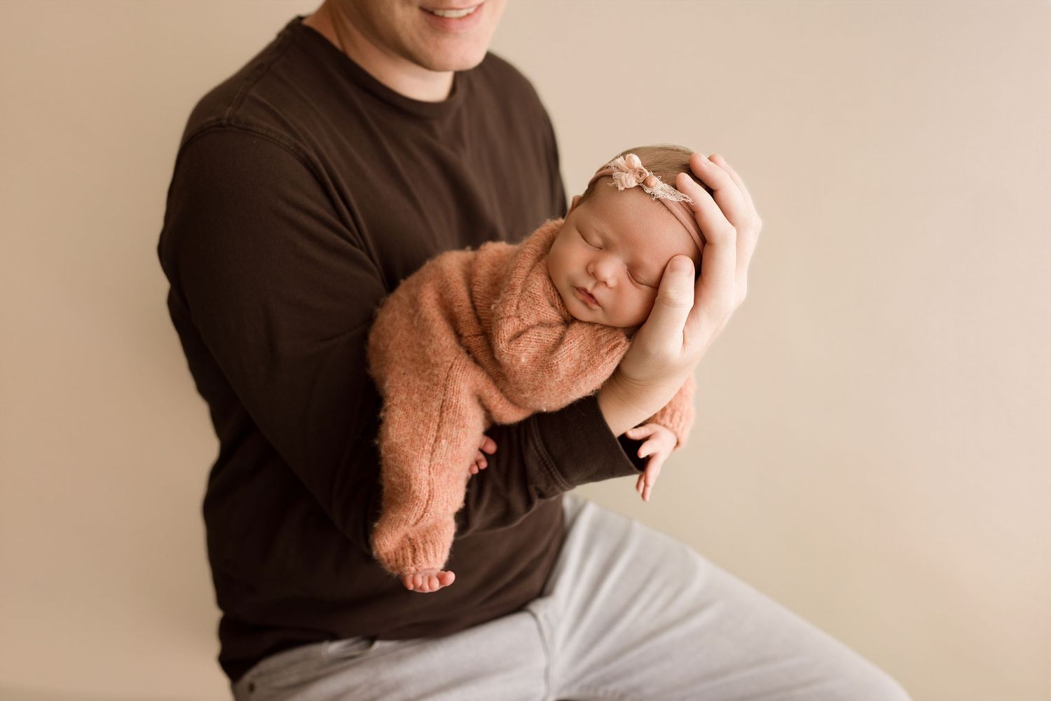 Baby girl during newborn session with Bree Elle Photography in Port Neches, TX studio.