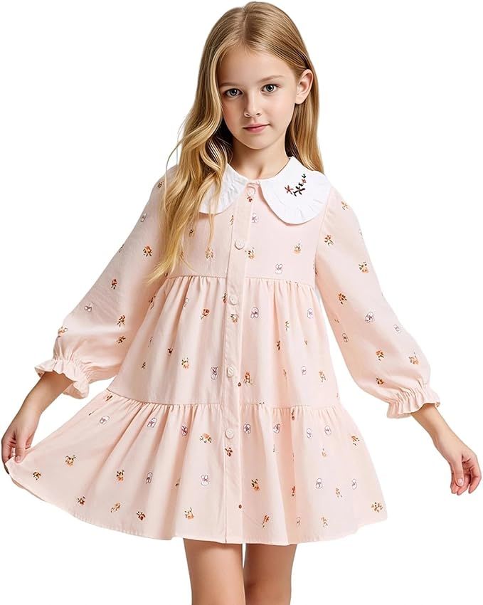 Girls pink empire waist dress with floral details and puff sleeves in four different views for online shopping.