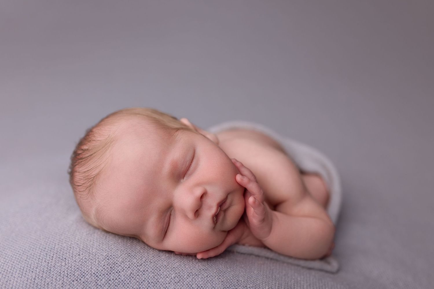 Newborn baby during newborn session with Bree Elle Photography in Port Neches, TX studio. Lumberton, Silsbee, Beaumont, Nederland, Southeast