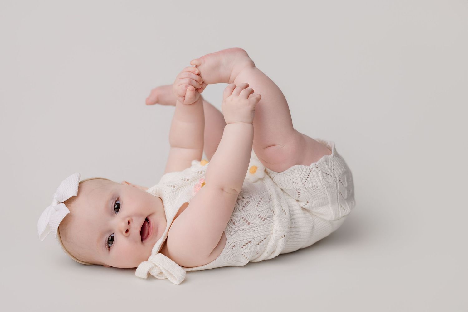 6 month old baby girl during milestone session with Bree Elle Photography in Port Neches, TX.