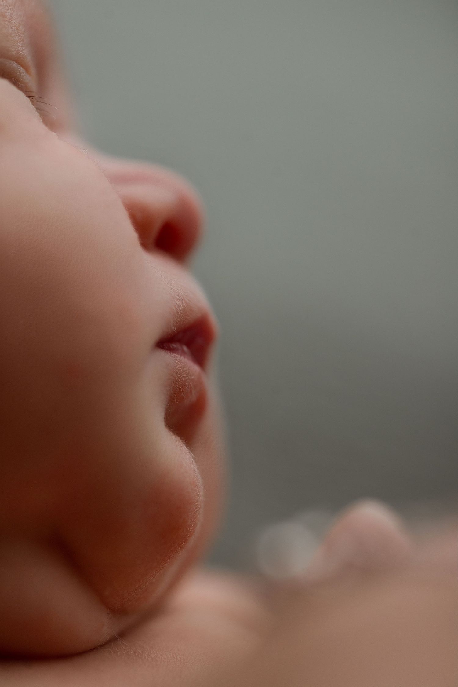 Baby girl during newborn session with Bree Elle Photography in Port Neches, TX studio.