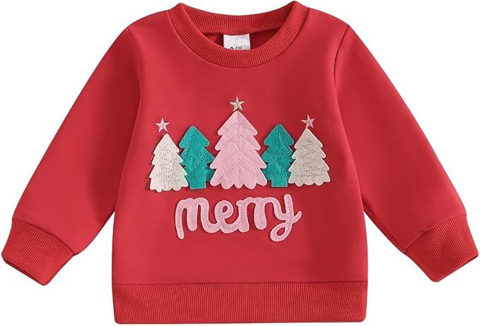 Red holiday sweatshirt with festive Christmas tree designs and merry text in white and pastel colors.