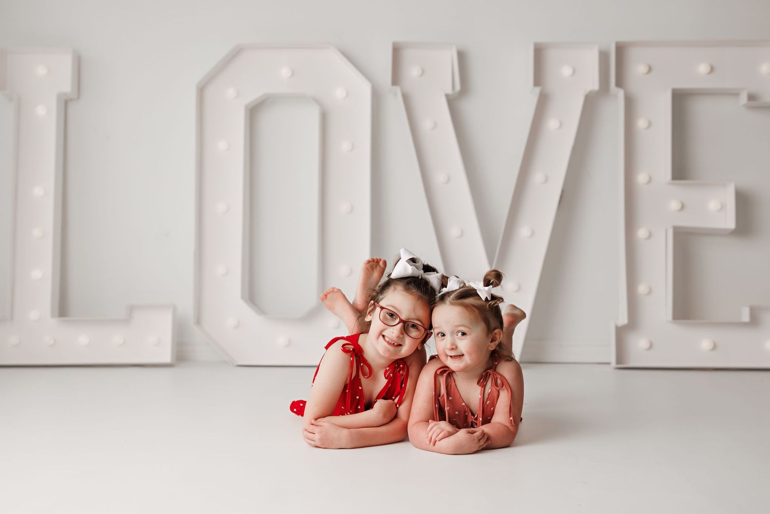 White block letters spelling LOVE on a clean minimalist white background.