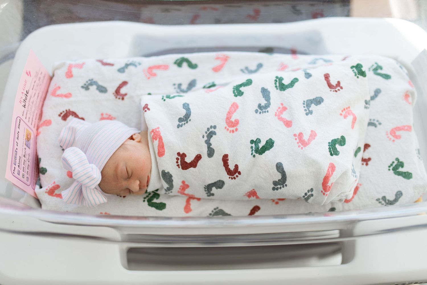 Newborn baby in bassinet during their Fresh 48 session with Bree Elle Photography in Beaumont, TX at St. Elizabeth hospital.