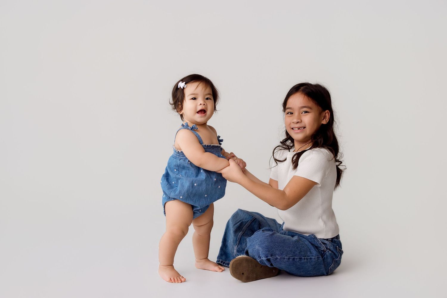 One year old family portion with sibling during one year session Bree Elle Photography in Port Neches, TX.