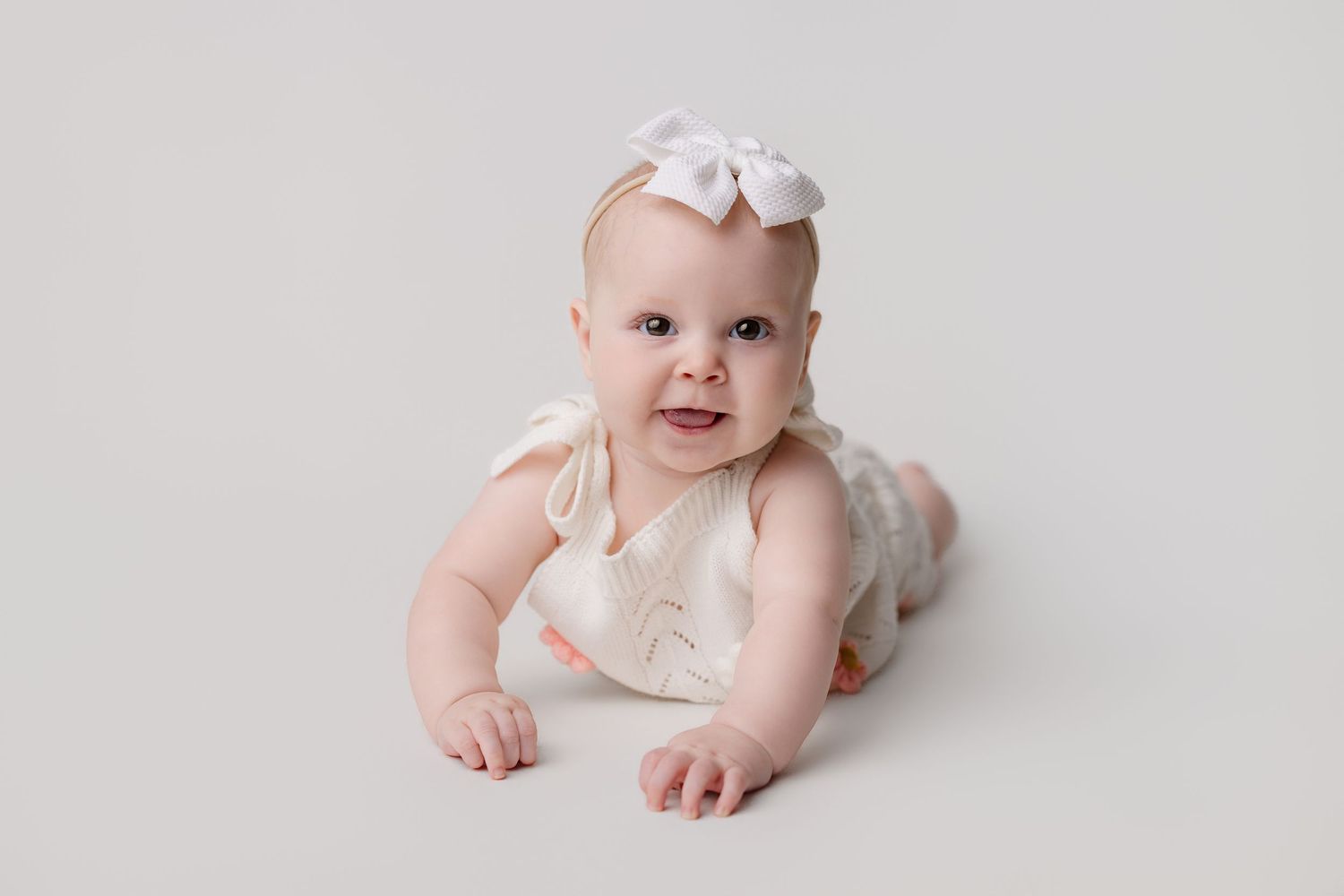 6 month old baby in milestone session with Bree Elle Photography in Port Neches, Tx studio.