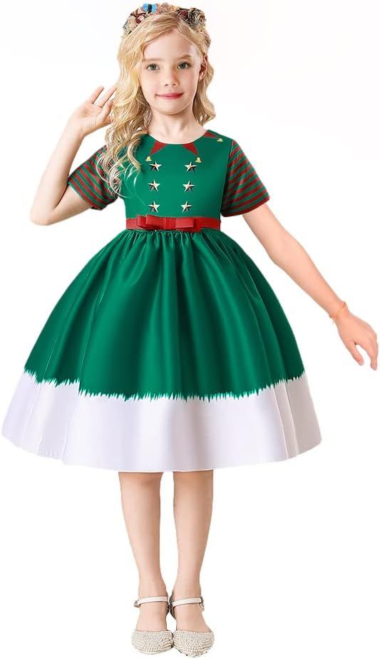 A festive green and white holiday dress with mesh sleeves, red bow belt and embellished bodice details.