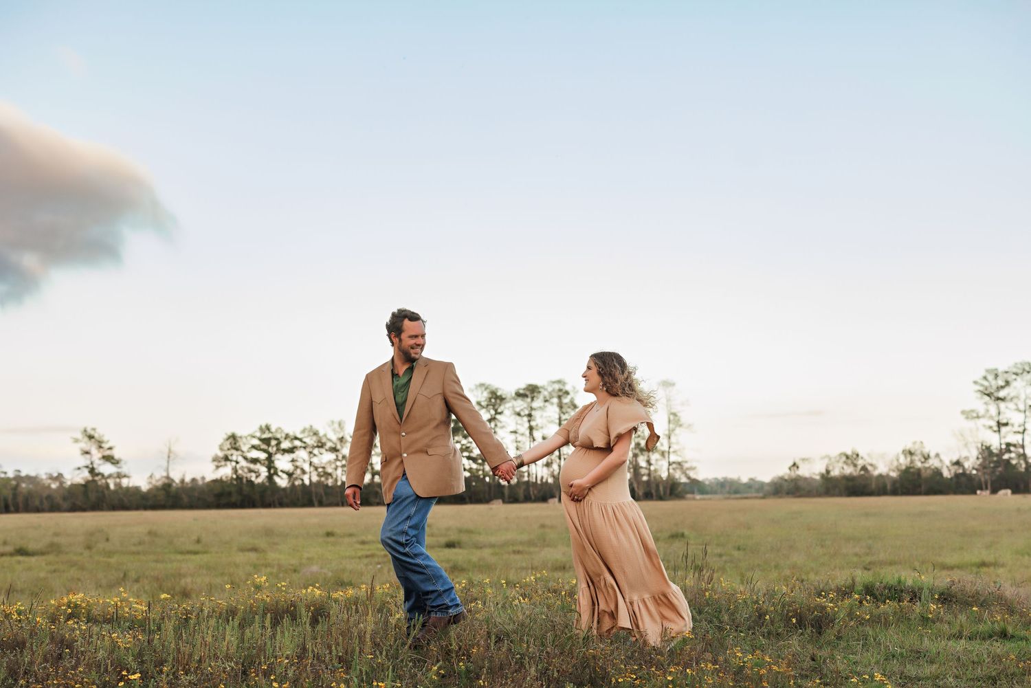 Romantic couple's maternity shoot in field during sunset with Bree Elle Photography in Orange, TX.