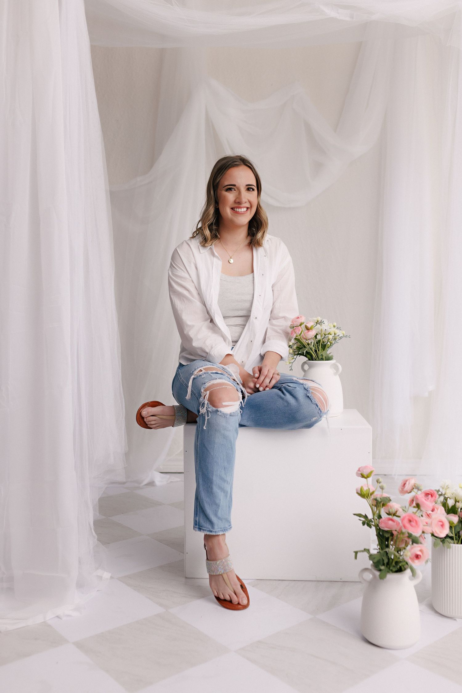 Parent and toddler in matching white tops and jeans during mommy and me session with Bree Elle Photography in Port Neches, TX.