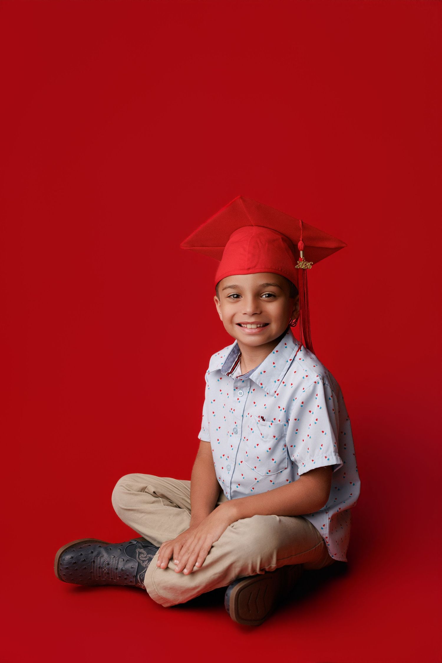 Bridge City kinder graduation portrait session with cap and gown in Port Neches, TX with Bree Elle Photography.