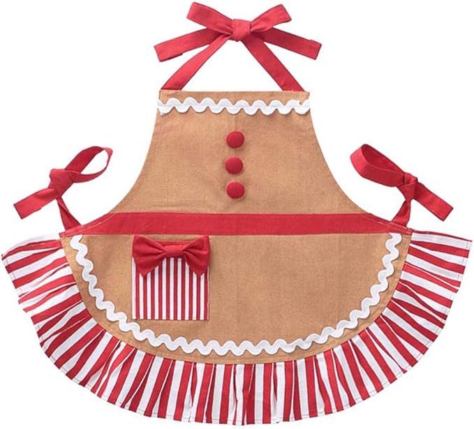 Four festive gingerbread ornaments with red ribbons, white trim and striped skirts arranged in a horizontal row.