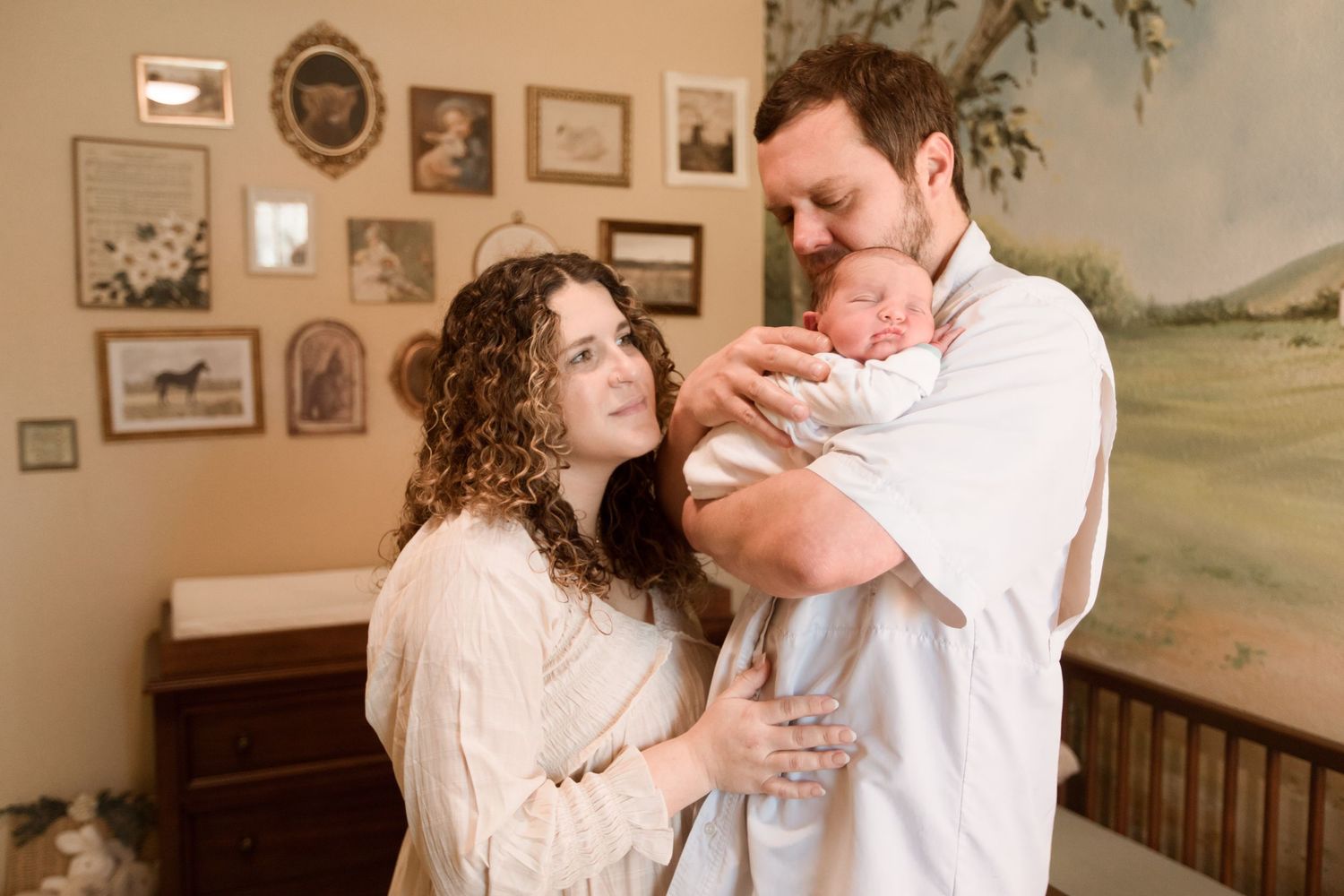 Mom, dad, and newborn baby during Fresh 48 session in Beaumont nursery session.