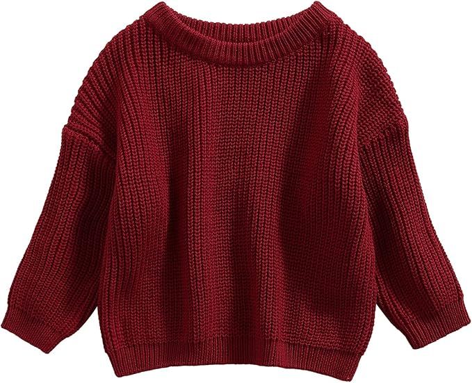 Burgundy red chunky knit sweater with dropped shoulders and ribbed trim details.