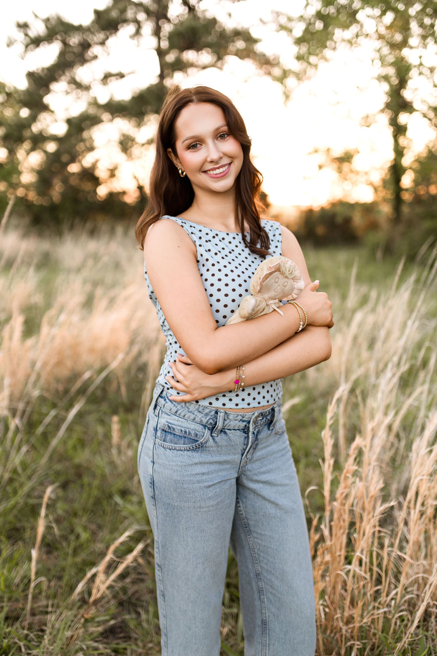 Bree Elle Photography Seniors by Alicia Stephenson. Session with girl in a Beaumont, TX field during senior year photo session.