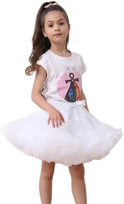 Young dancer in white tutu dress and graphic t-shirt strikes four graceful ballet poses.
