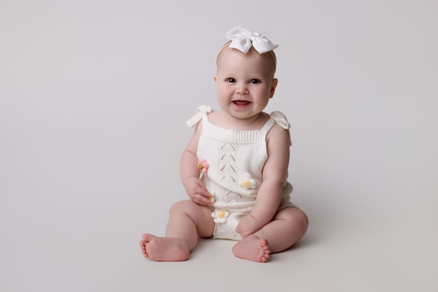 6 month old baby in milestone session with Bree Elle Photography in Port Neches, Tx studio.