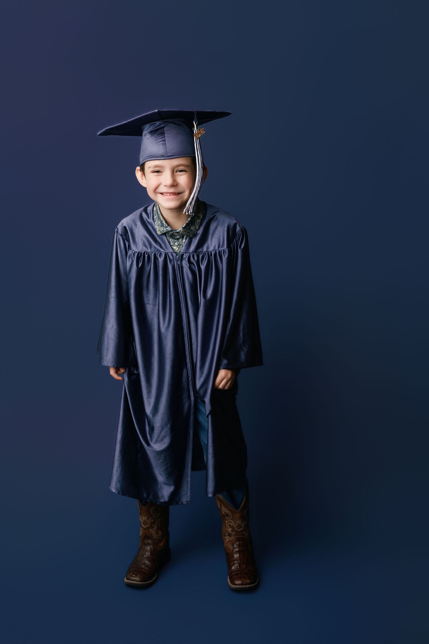 Kinder graduation portrait session with cap and gown in Port Neches, TX with Bree Elle Photography.