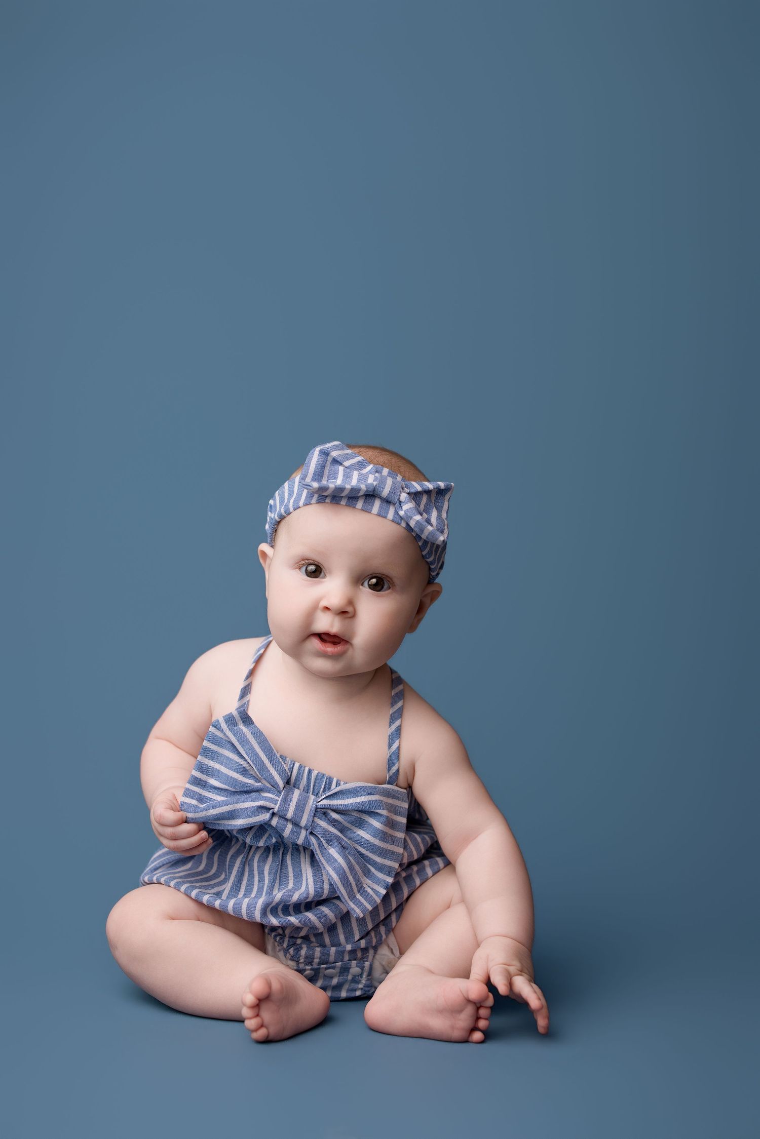 6 month old during her milestone session with Bree Elle Photography in Port Neches, TX studio.