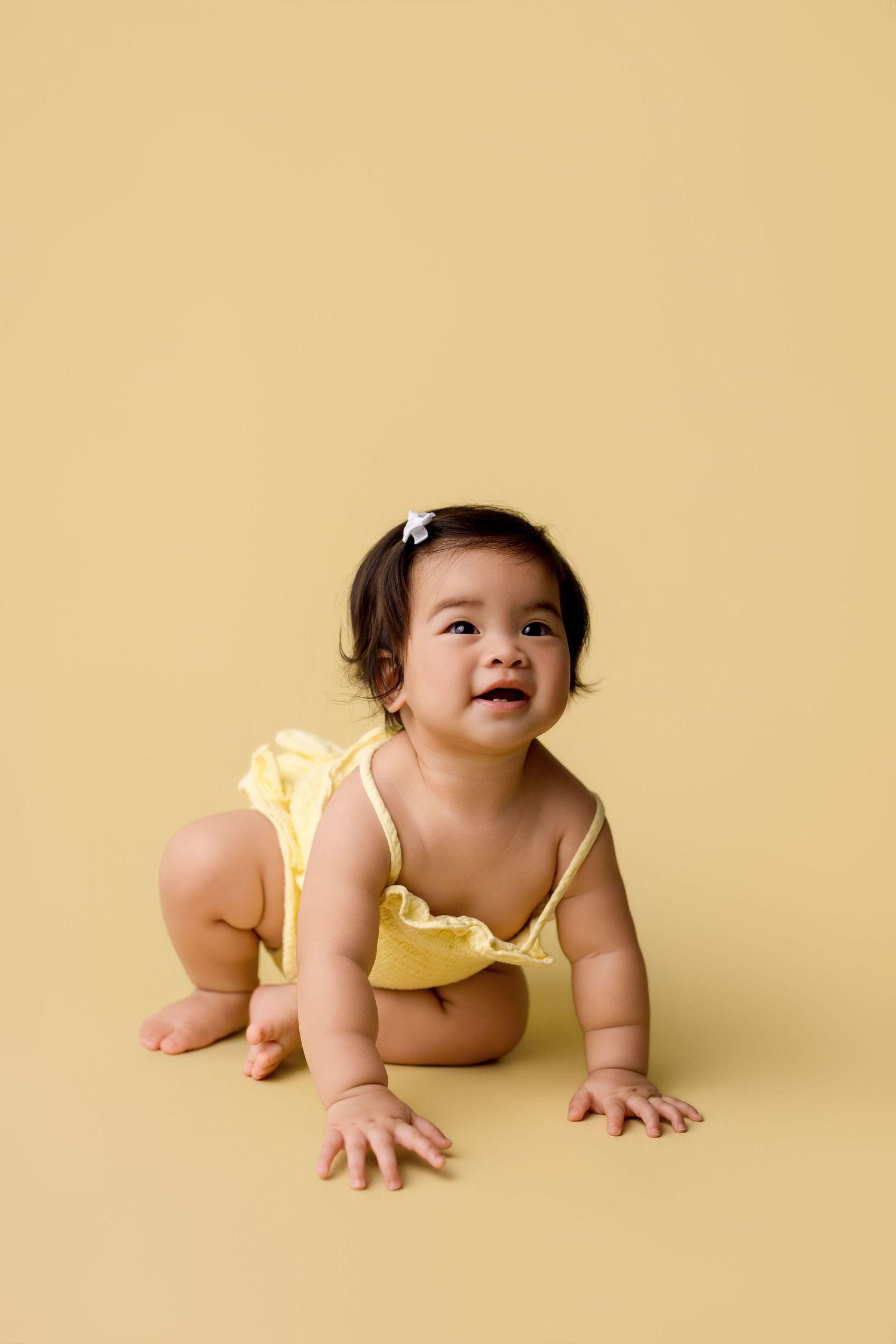 One year old during her portrait portion of her one year session with Bree Elle Photography in Port Neches, TX.