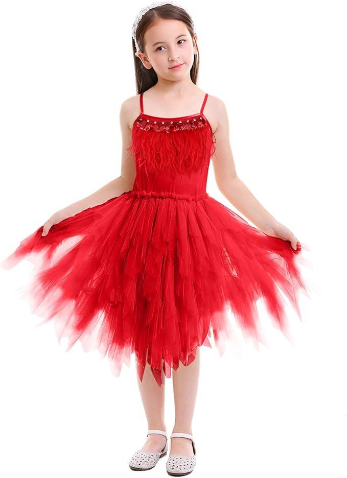 A young dancer twirls in a bright red tulle tutu dress with spaghetti straps and white shoes.