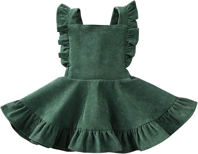 A green velvet baby dress with ruffled details and cross-back straps shown from multiple angles.